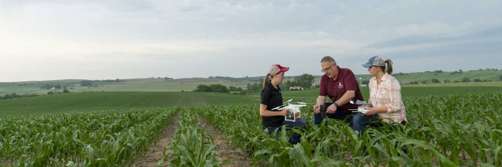 students in field with drone