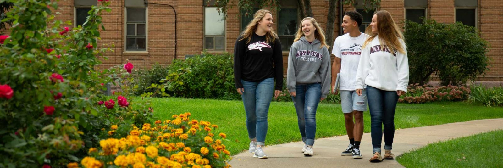Students walking by Lewis Hall at Morningside College