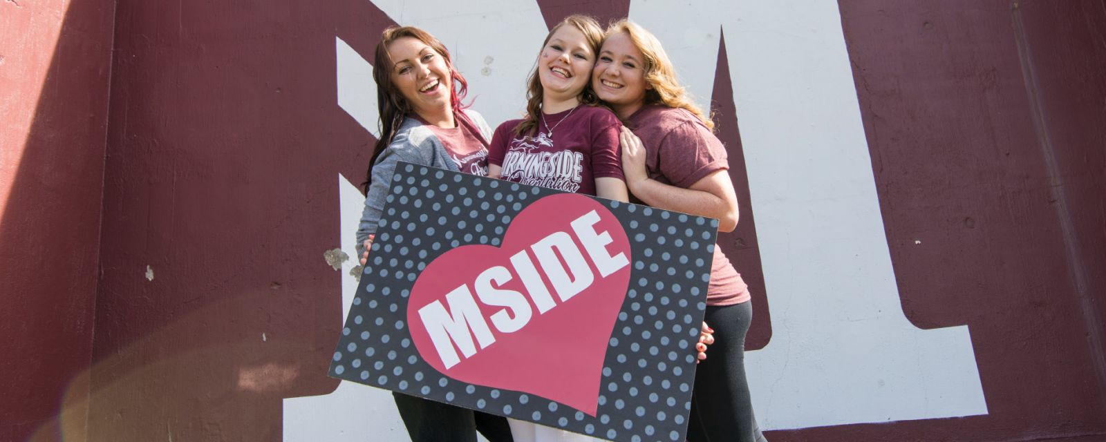 students with mside sign